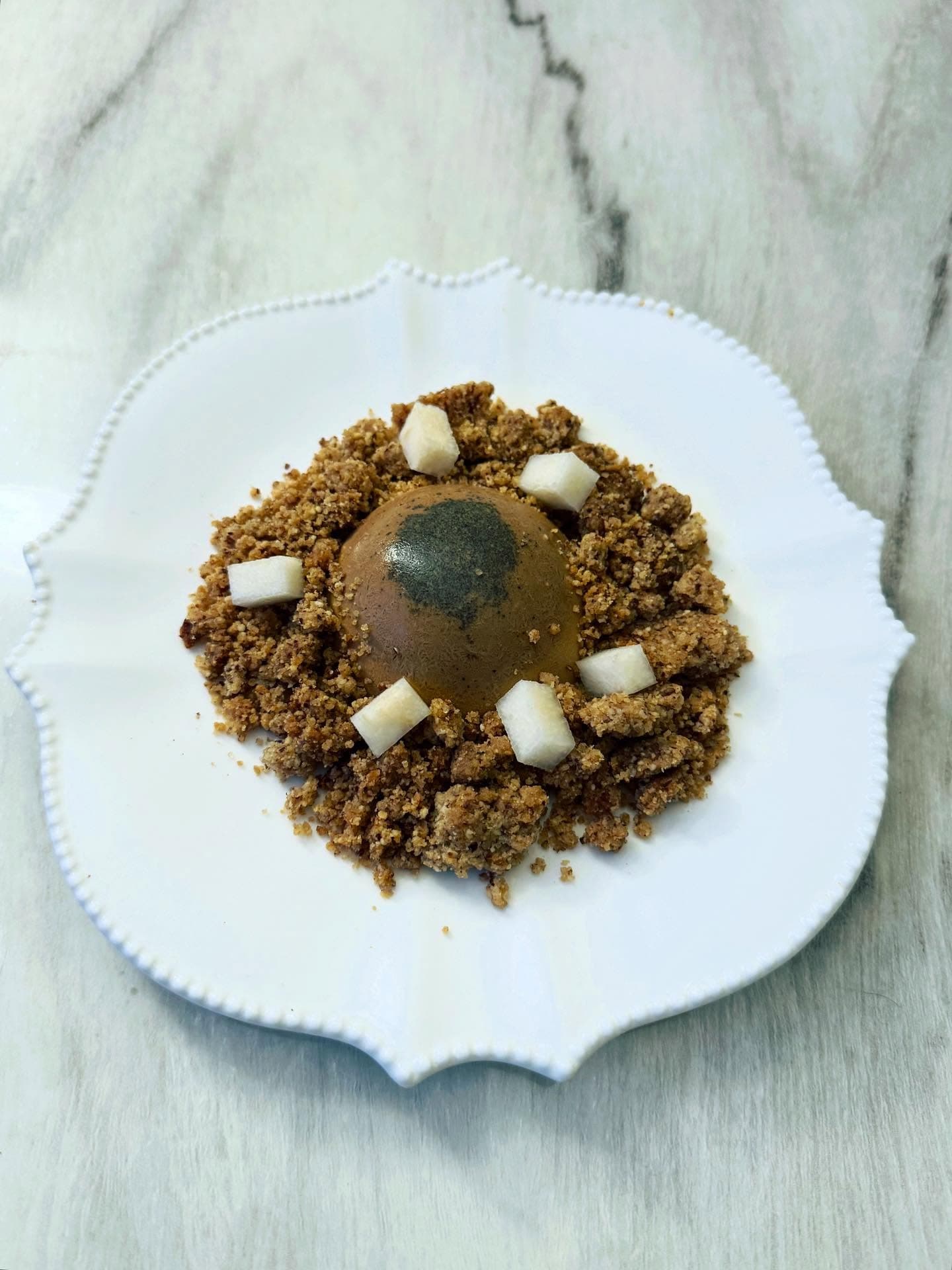 South Indian black tea panna cotta with almond crumble and fresh pear