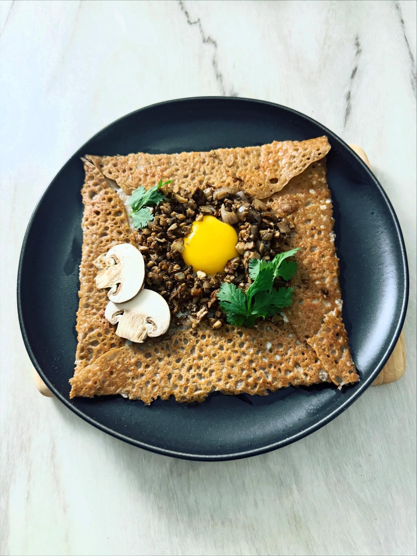 Buckwheat crêpe with mushroom duxelles, garam masala and egg