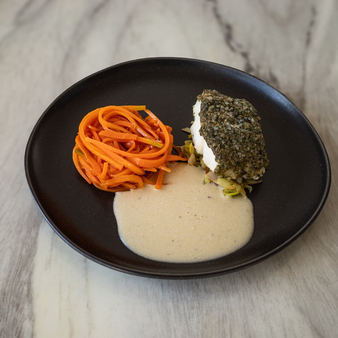 Cod fillet with coriander mint crust, carrot and coconut milk sauce