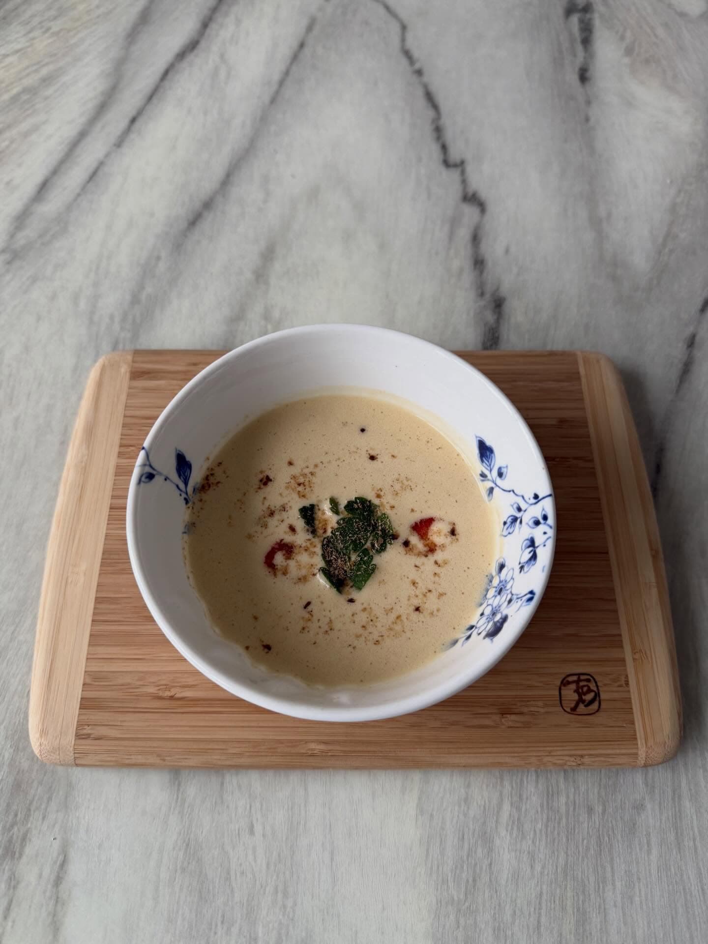 Langoustine bisque with coconut milk and black lime